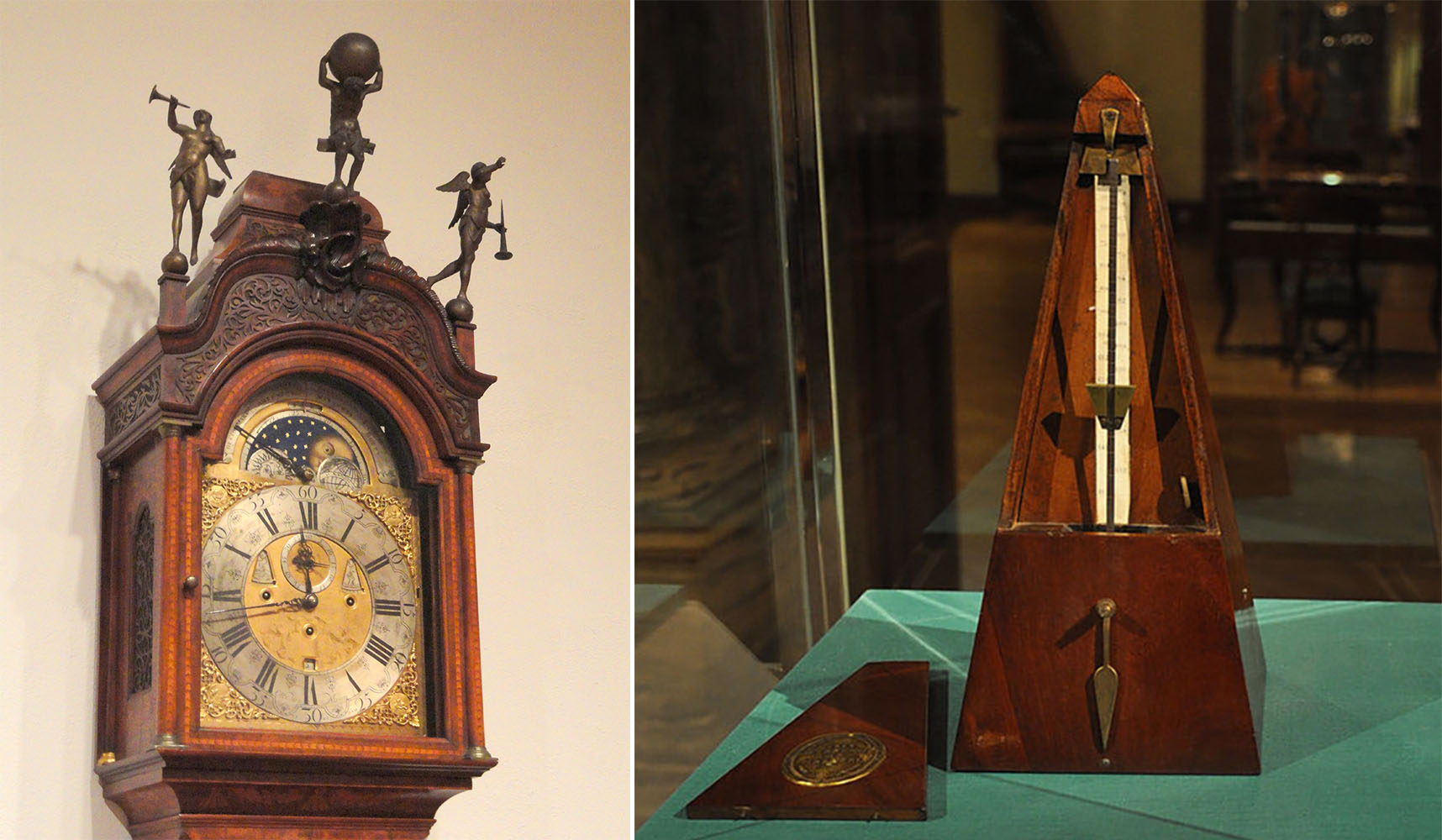 An antique ornate clock. Two angels hold trumpets and Atlas holds up the world on the top of the clock. 