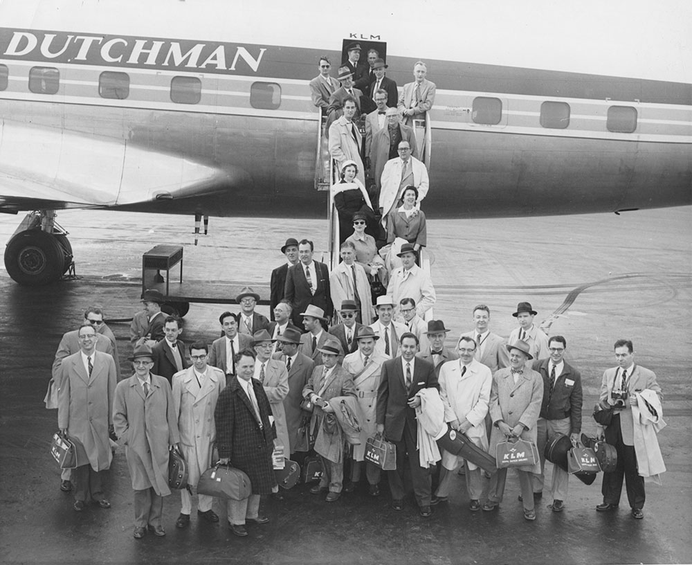 Orchestra musicians posing on the plane