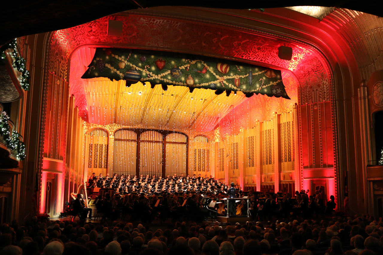 Lisa Wong leads choristers during the 2019 Holiday Concert on the elaborately decorated Severance stage
